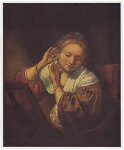 Young woman at her mirror by Rembrandt